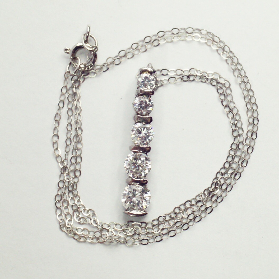 Sterling silver white/colorless CZ graduated five stone pendant necklace