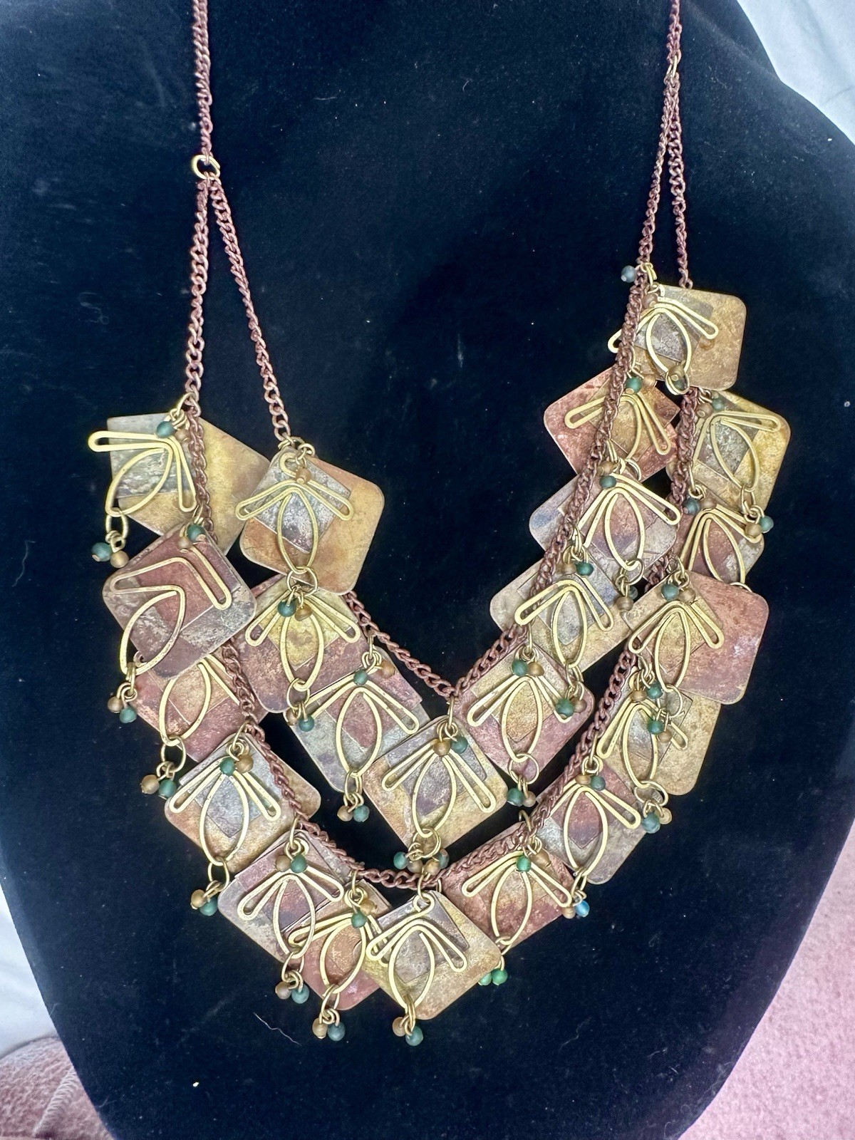 Vintage Metal Artisan Chain with Multi tiered Metal Patina Panels And Charms