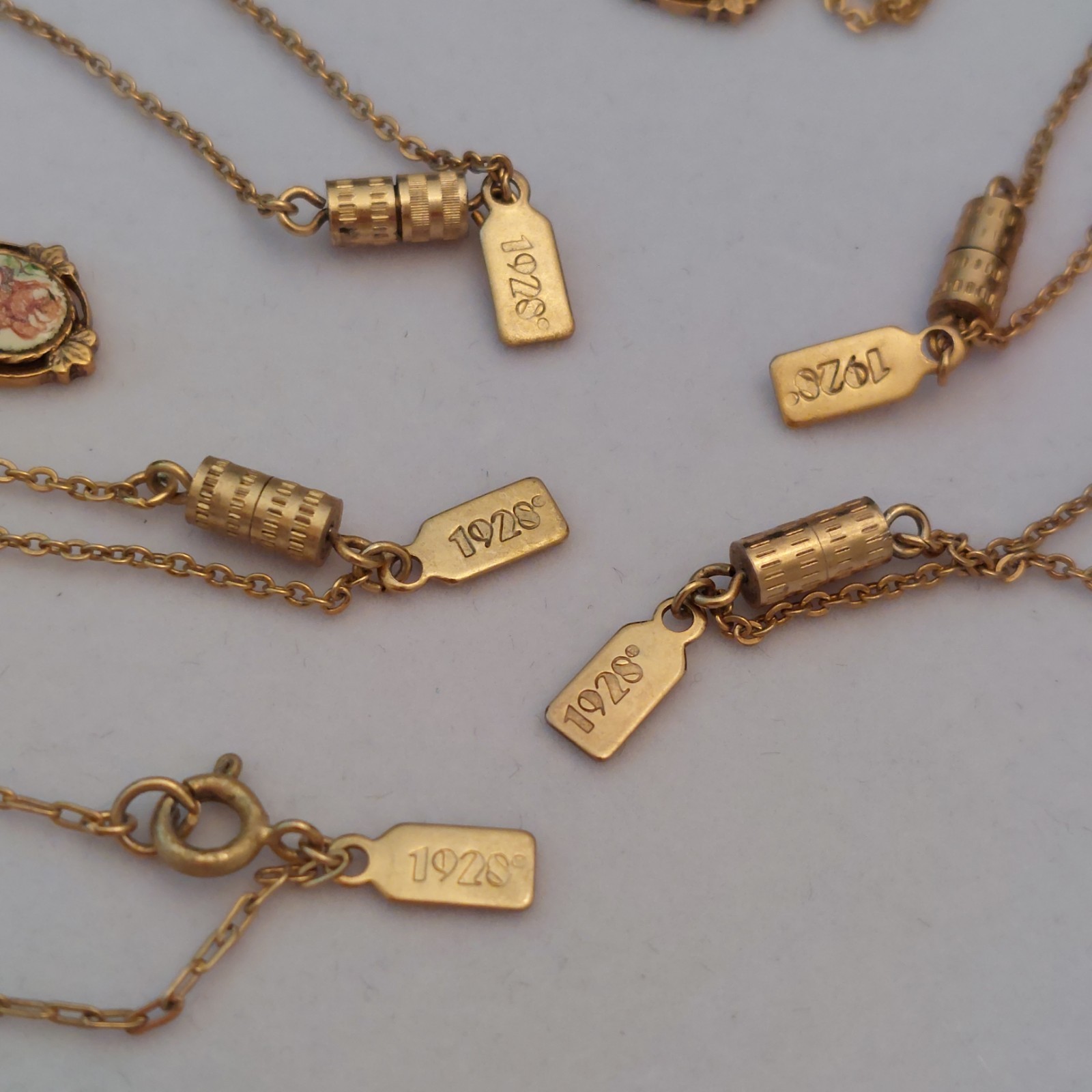 5 Gorgeous 1928 Brand Delicate Gold Tone Necklaces with various charms/looks