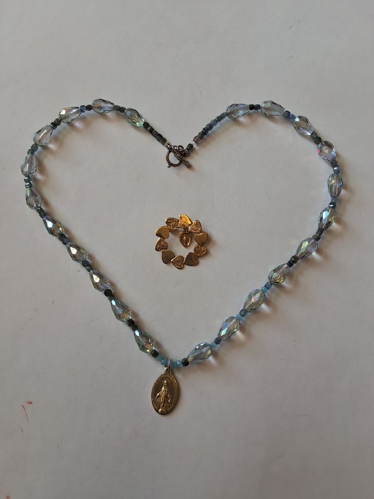 Iridescent Beaded Necklace With Gold Tone Miraculous Medal And Brooch