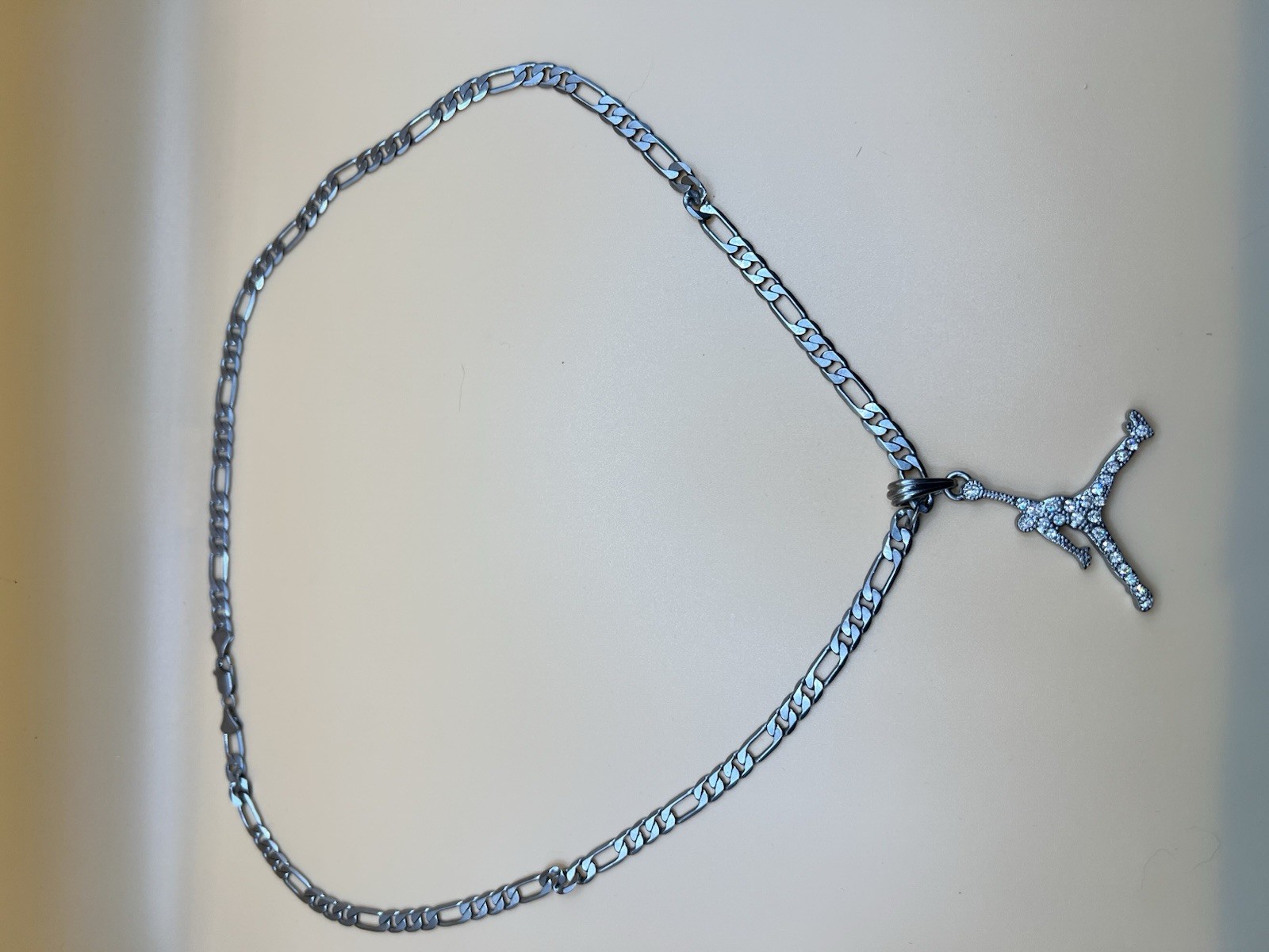 Silver Tone Stainless Steel Figaro Chain Necklace, Clear CZ Sports Charm Pendant