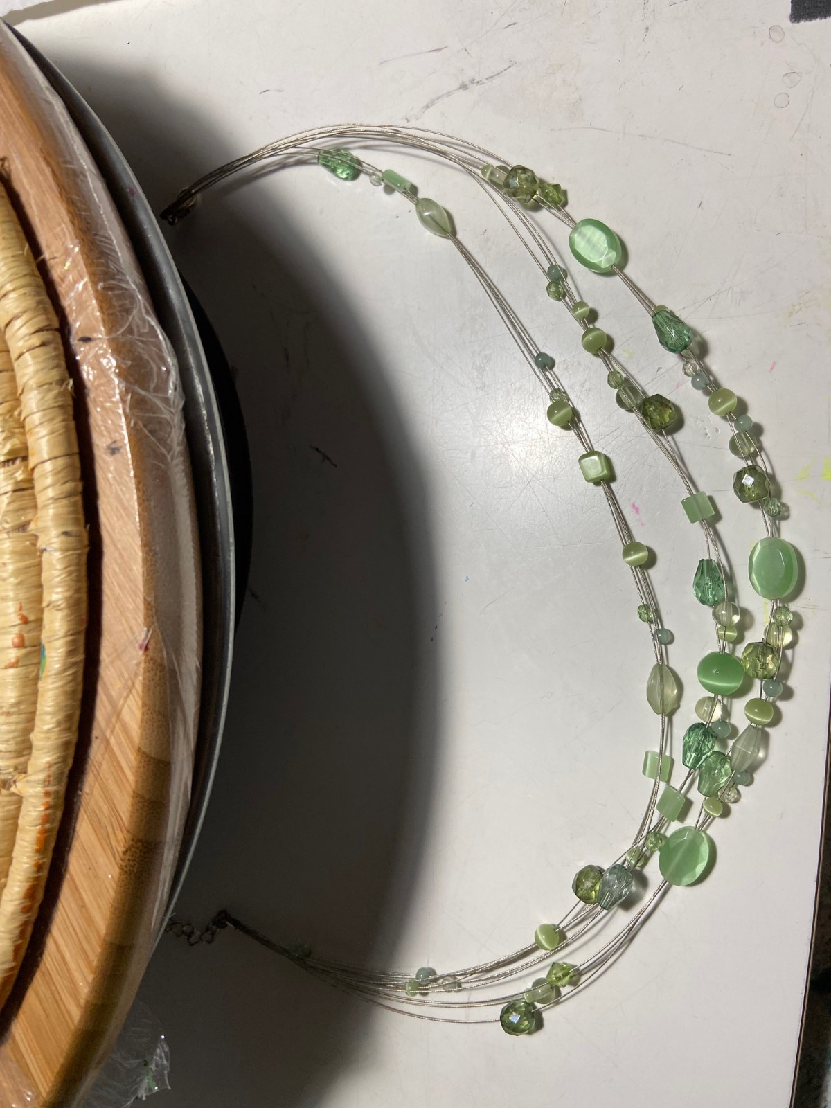 Invisibly strung light medium green color stones 3 Strands