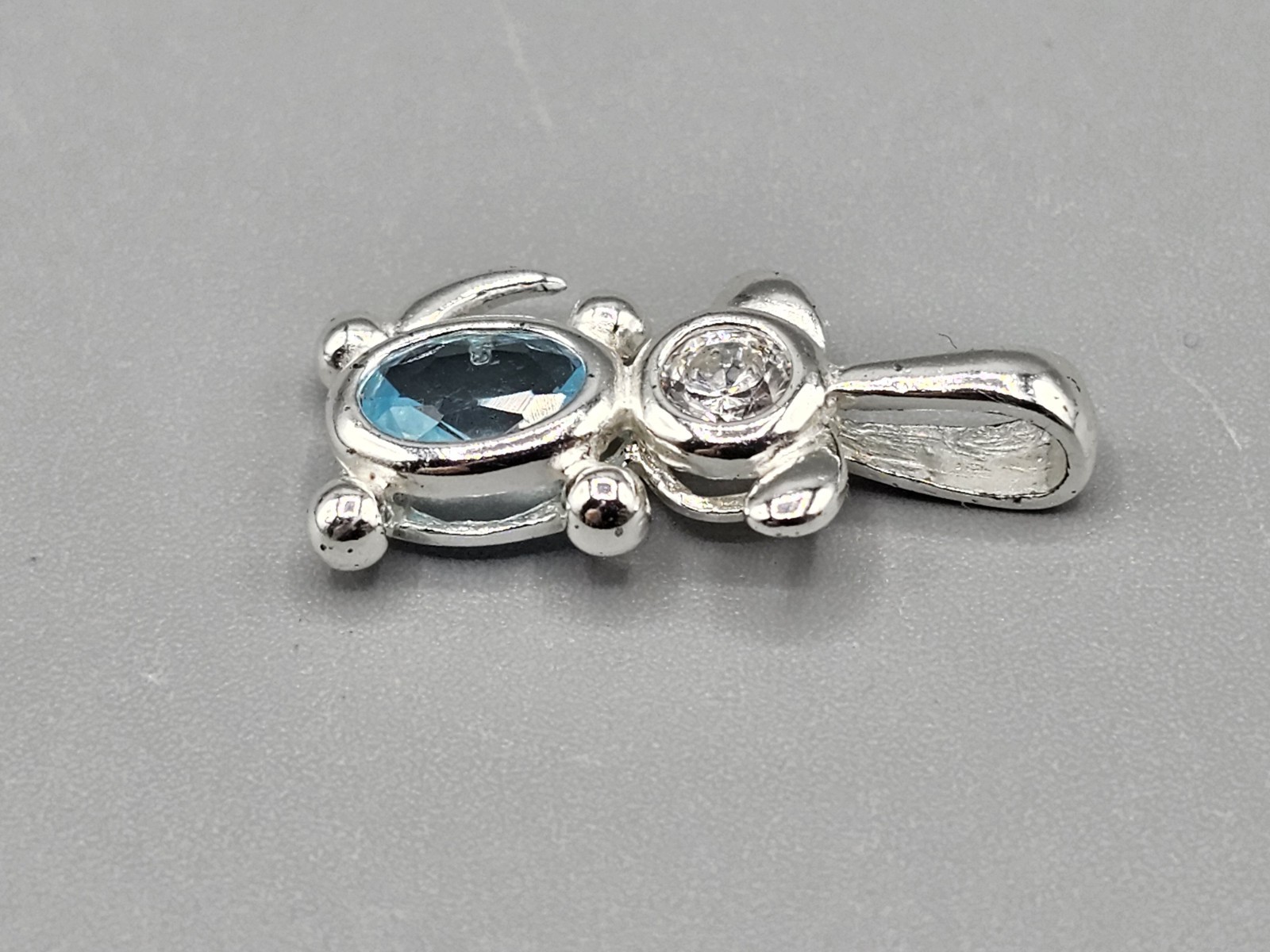 Sterling Silver Dog Bezel/Prong Set Cubic Zirconia Blue Simulated Stone Pendant