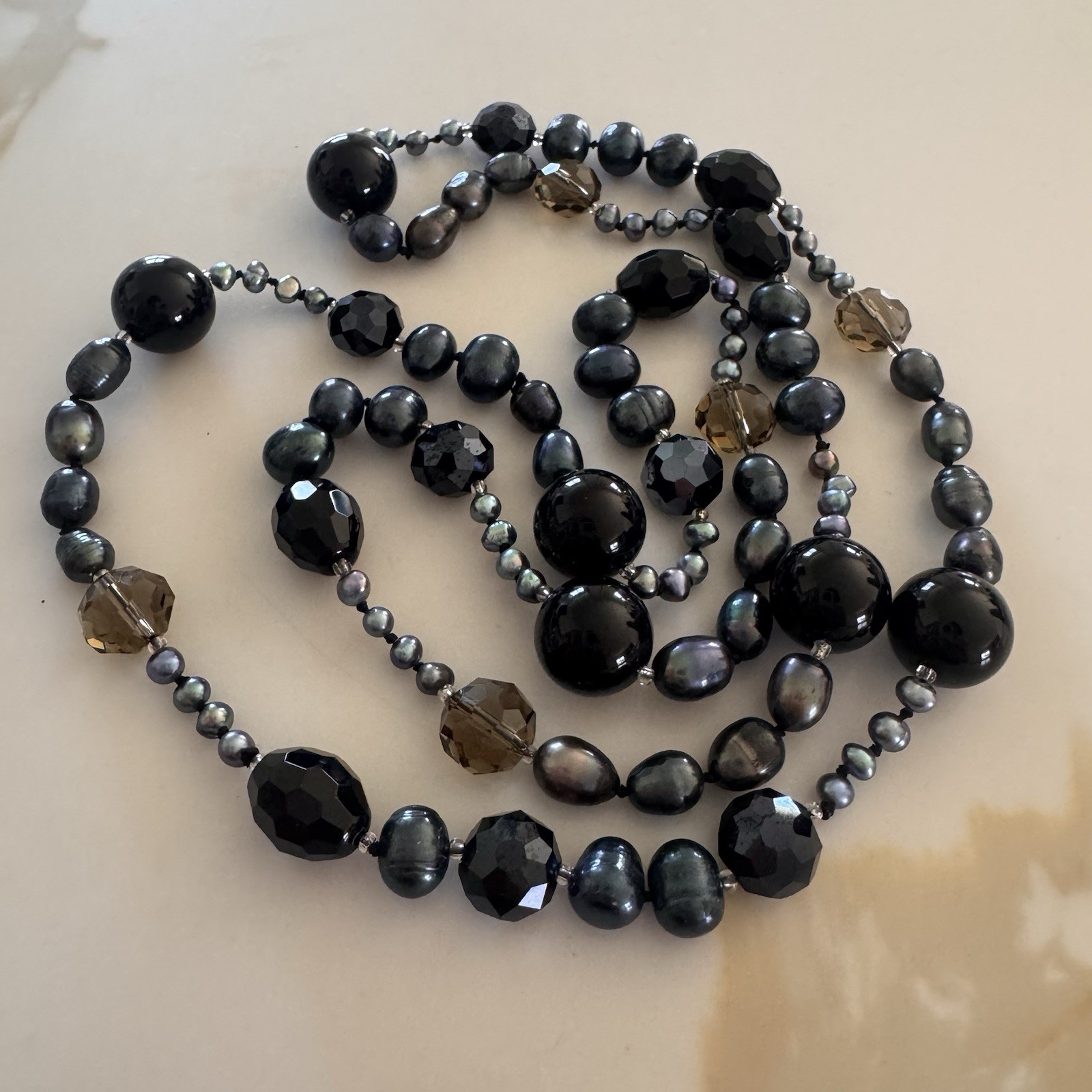 beautiful peacock pearl necklace with faceted gray and black beads