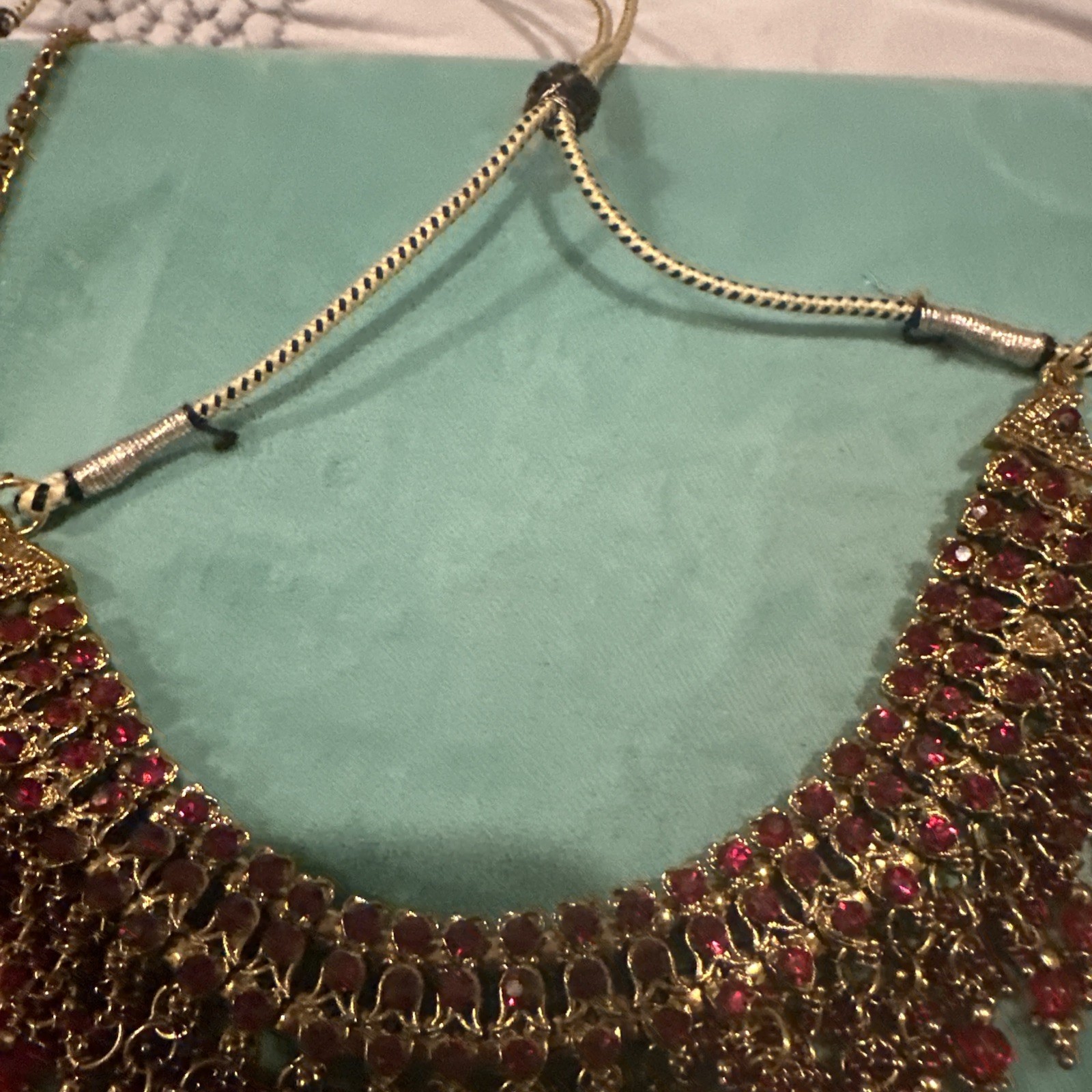 Fashion Jewelry Maroon Necklace With Jhumkas With Hair Attachment In Gold Tone