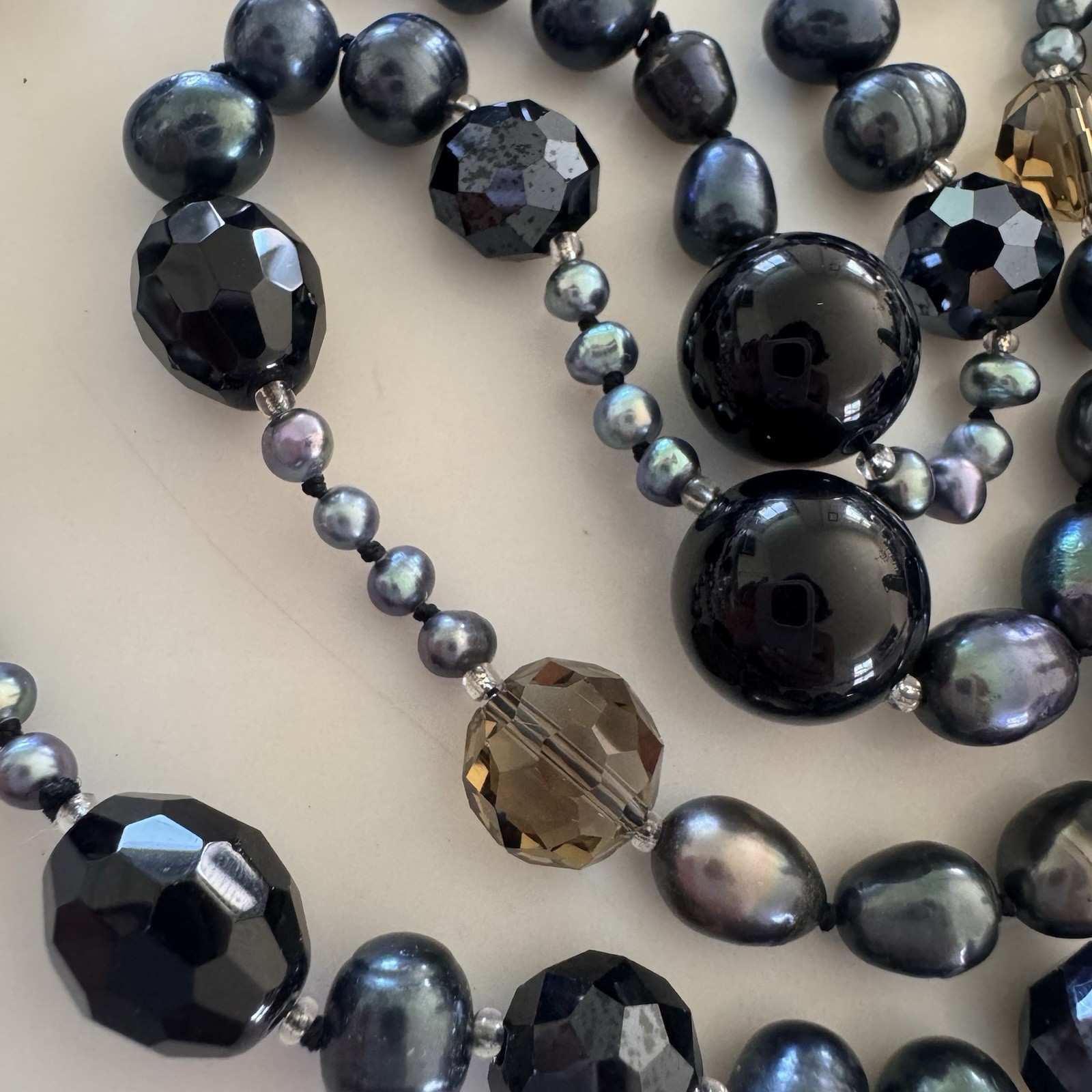 beautiful peacock pearl necklace with faceted gray and black beads