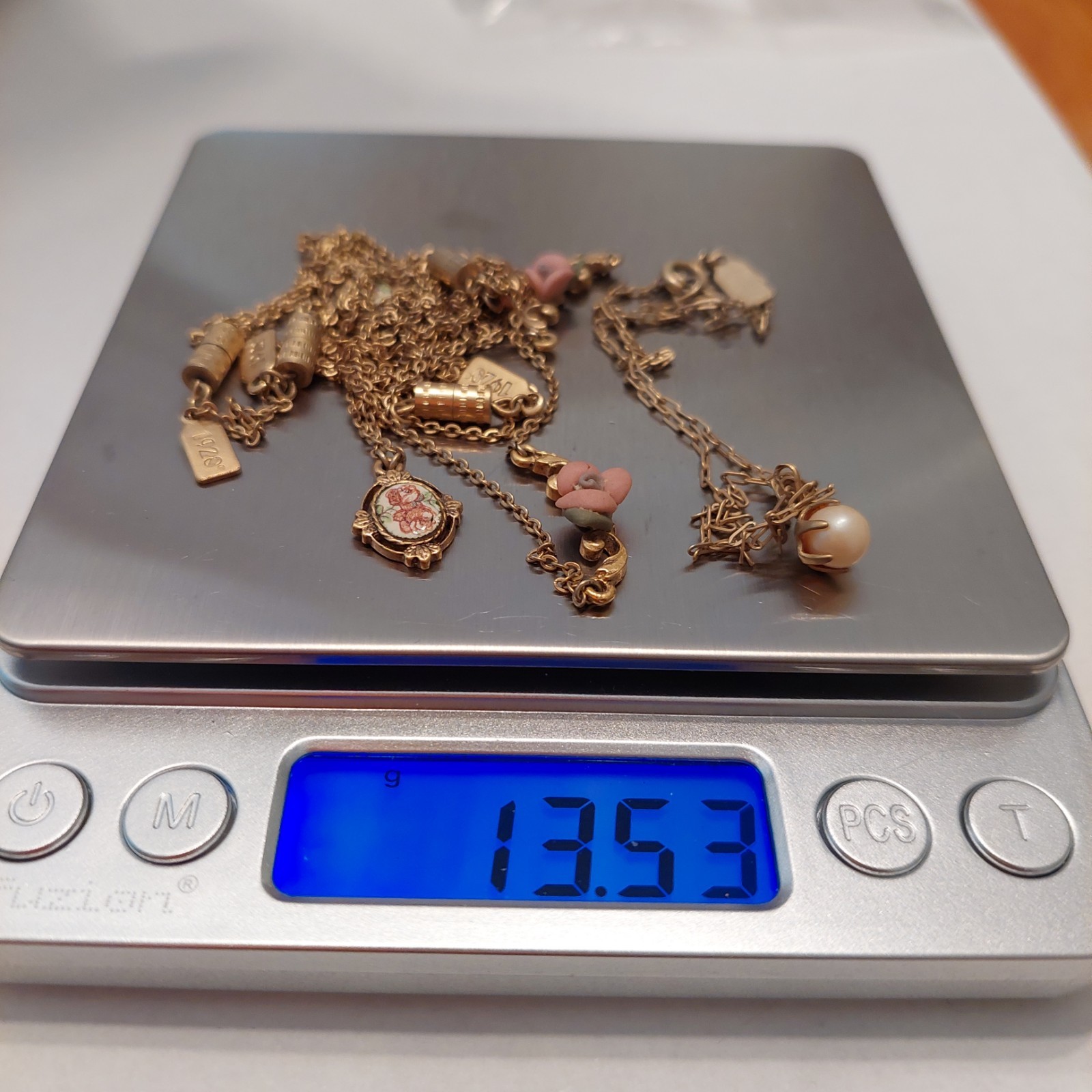 5 Gorgeous 1928 Brand Delicate Gold Tone Necklaces with various charms/looks