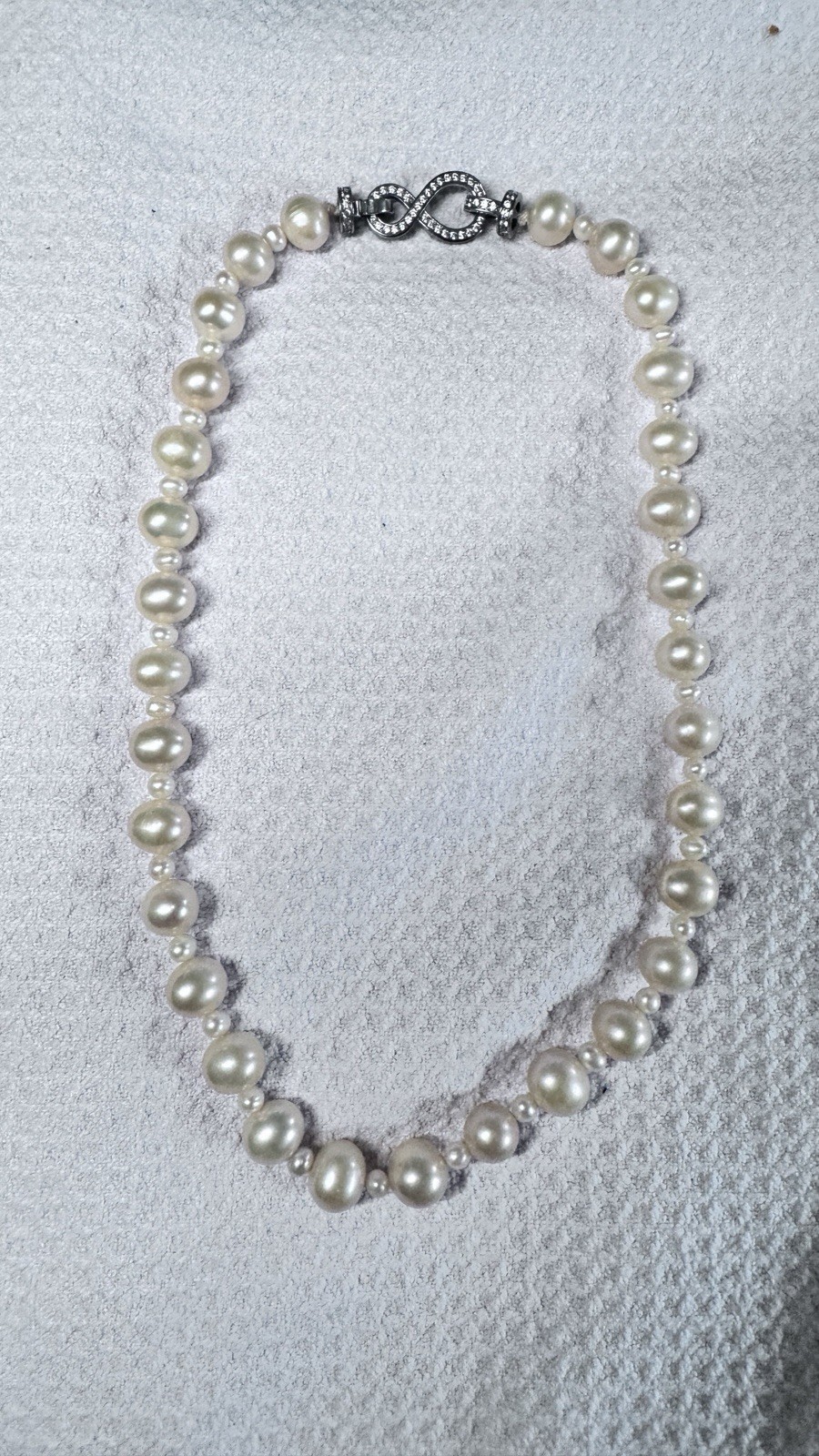 High-quality freshwater pearls with natural aurora luster. (11mm–12mm)