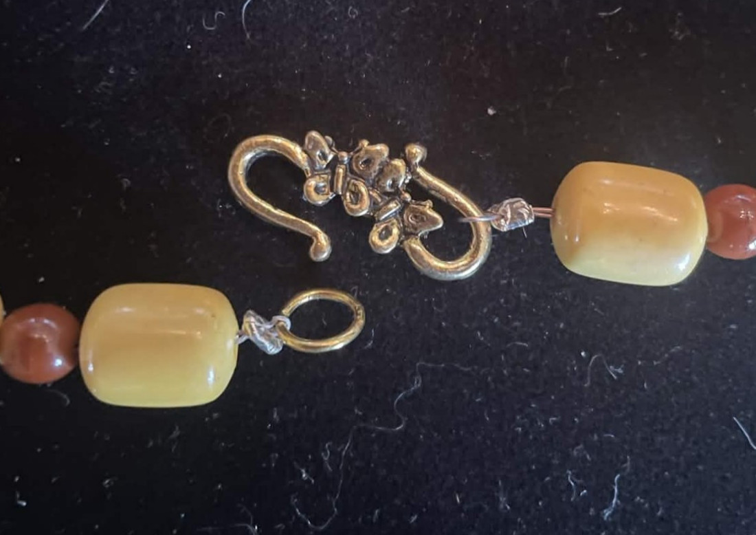 Yellow and Brown Beaded Necklace with Carved Wooden Pendant. 30 in. Gift box