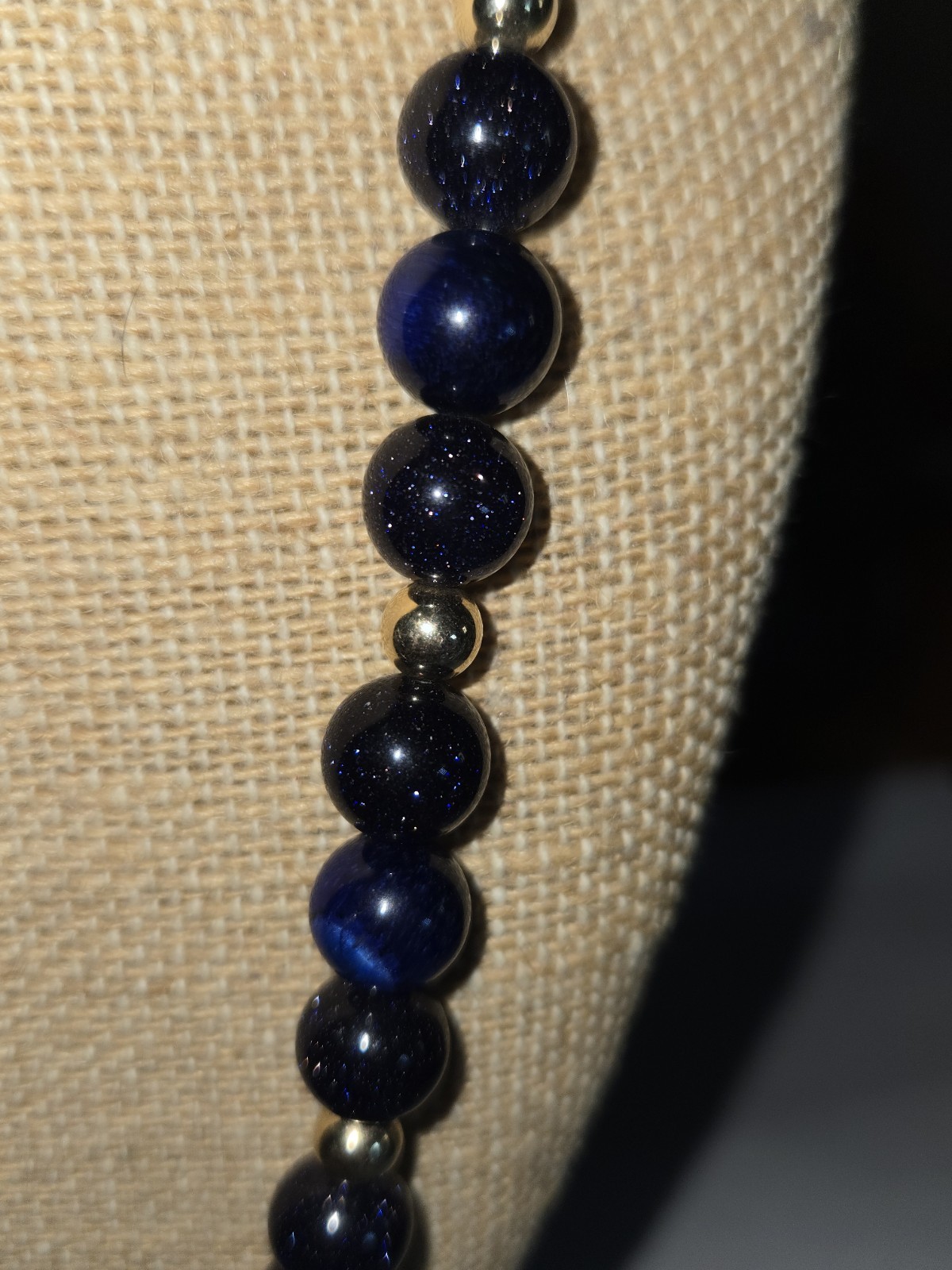necklace round sparkly blue glass beads accented with small golden Spacer Beads