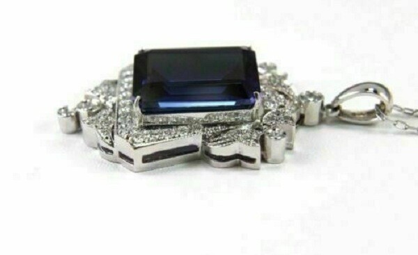 Pretty Emerald Cut Simulated Blue Sapphire Halo Pendant In 14k White Gold Plated