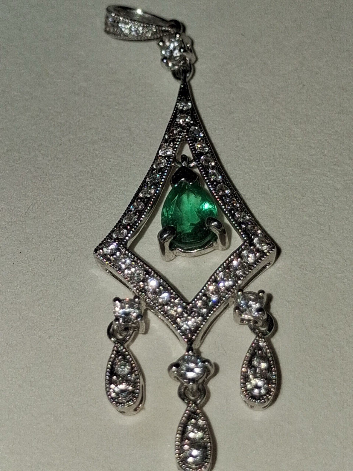 WHITE 18 KARAT/ ONE 0.36CT PEAR EMERALD 54=0.50TW ROUND H/I SI2 DIAMONDS