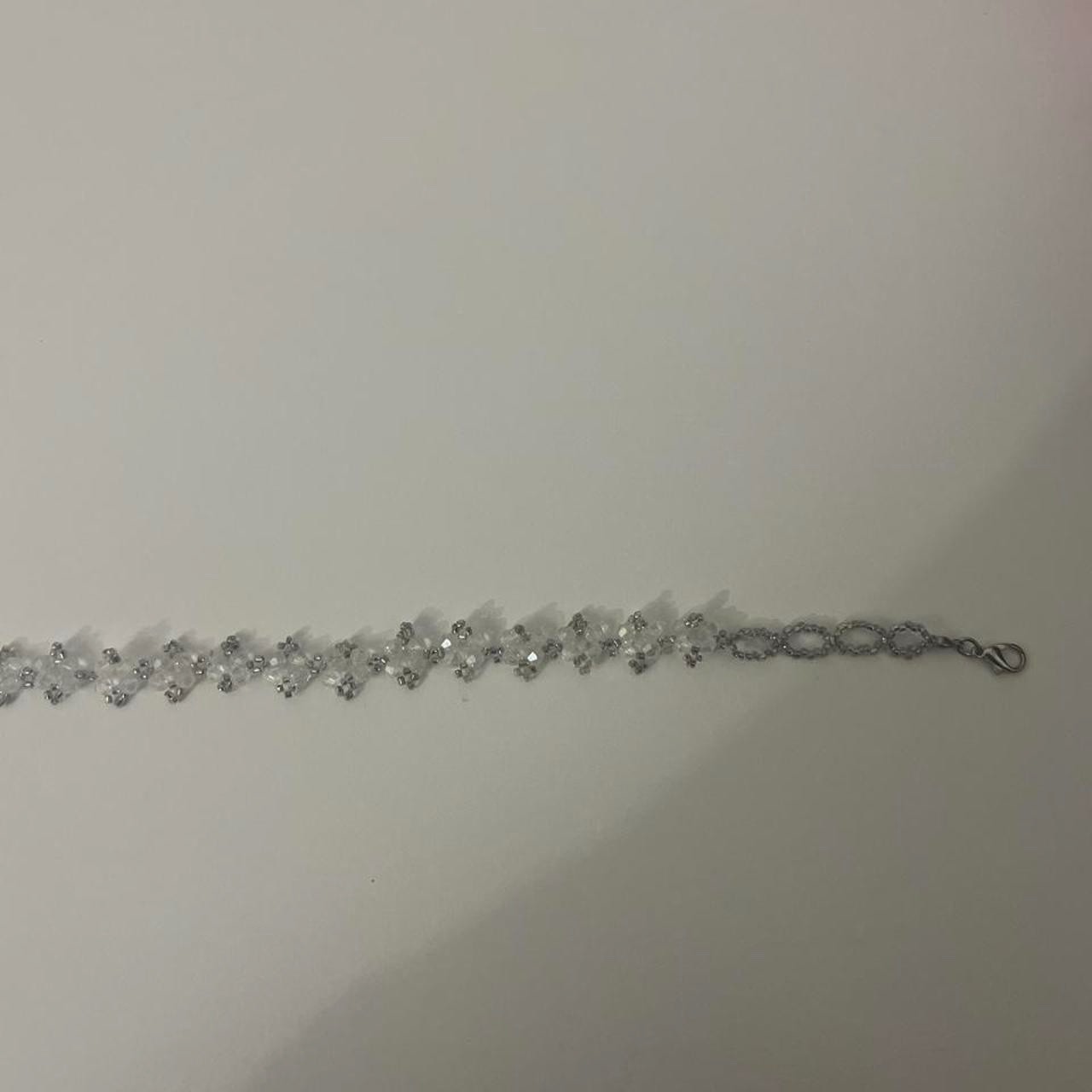 Pack of chocker necklaces: -white daisy flowers (cloth chocker) -clear beaded