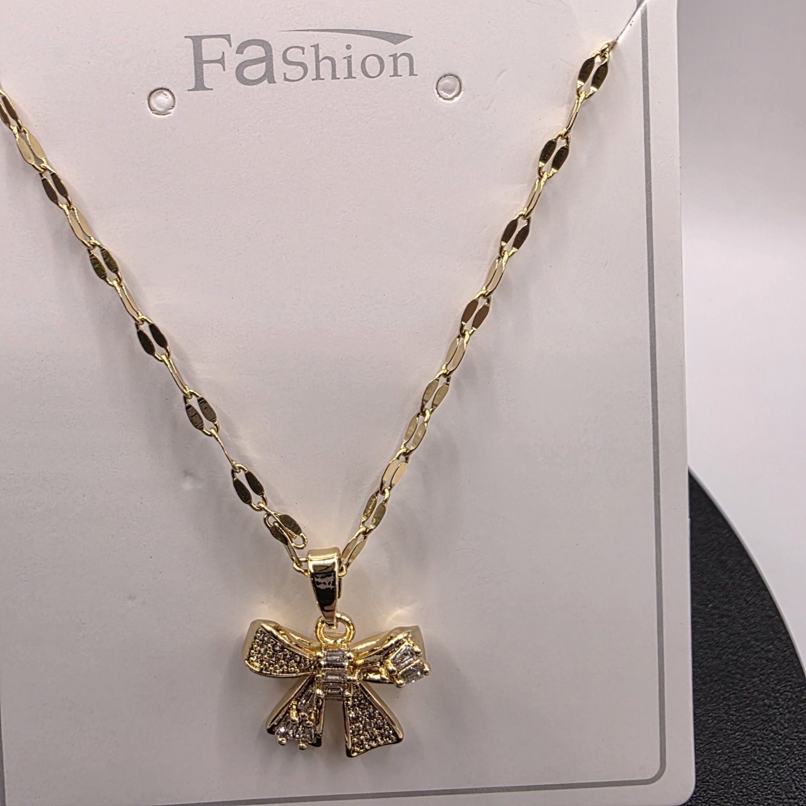 Stainless Steel Copper Plated 16″Necklace w/13mm Cubic Zirconia Bow Pendant