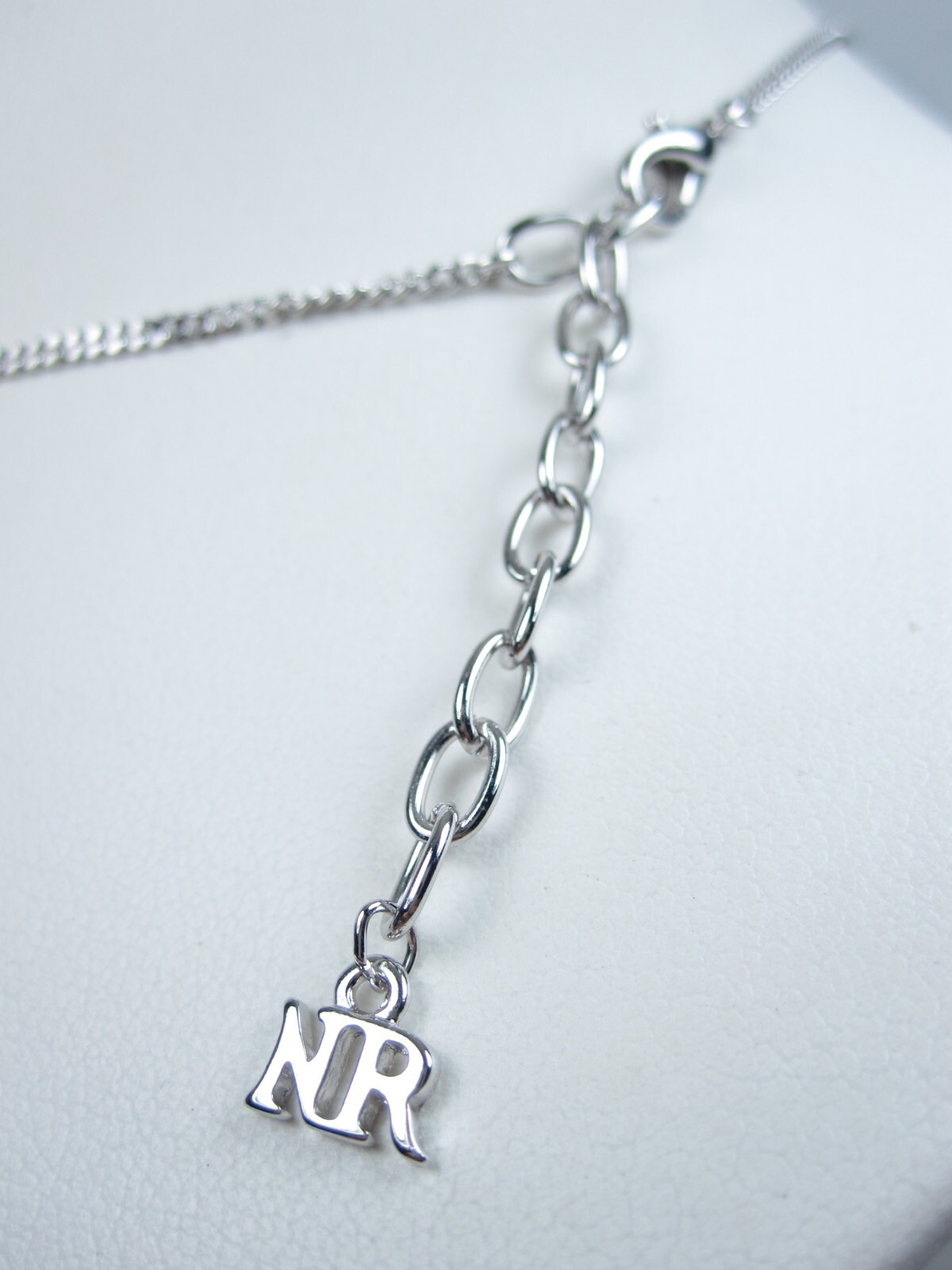 Nina Ricci Rhodium Plated Pendant with Swarovski Crystals – 16-18″ length – 3528