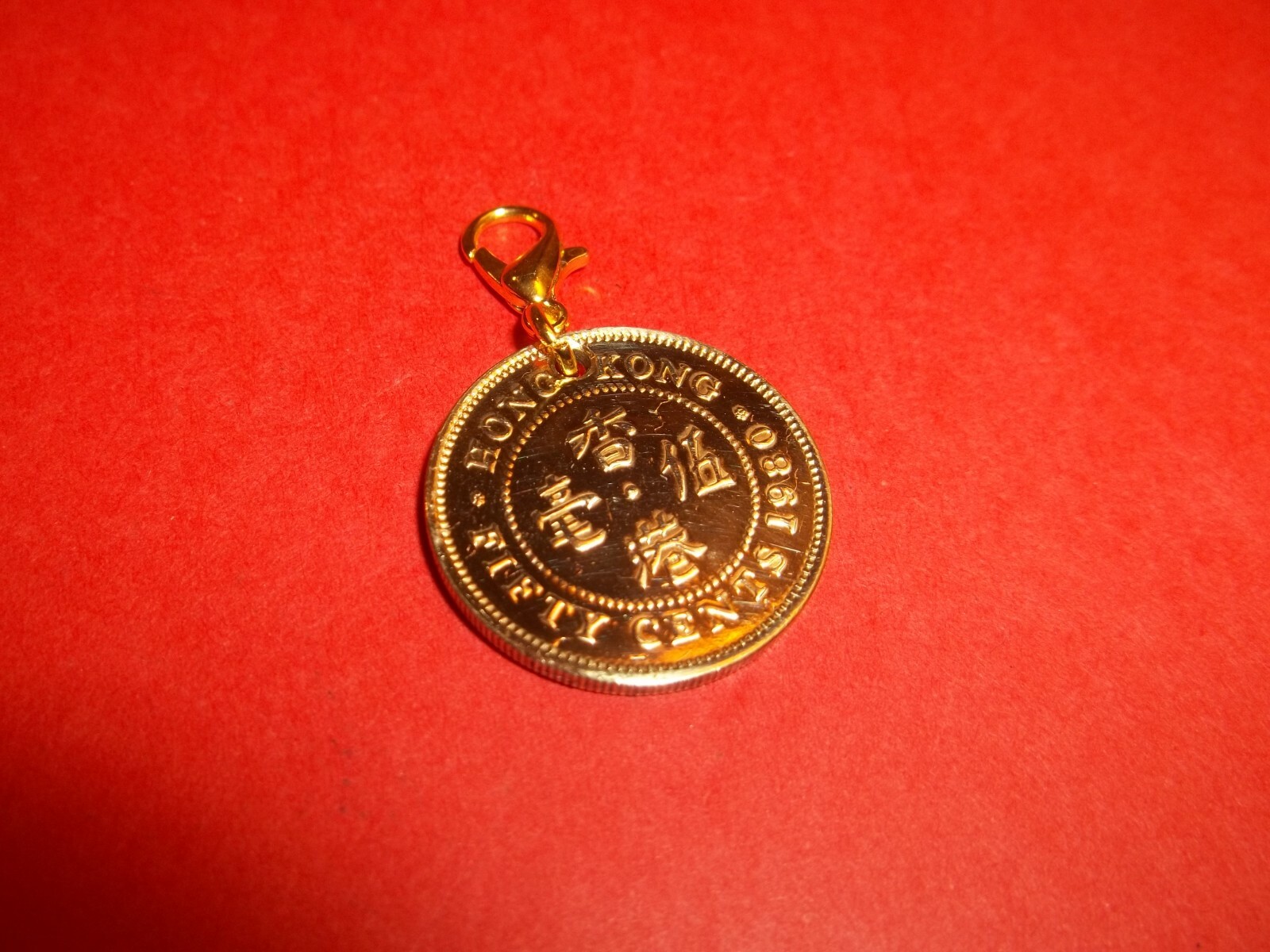 FIFTY (50) CENTS – HONG KONG – HIGHLY POLISHED PENDANT / CHARM – 1977 to 1998