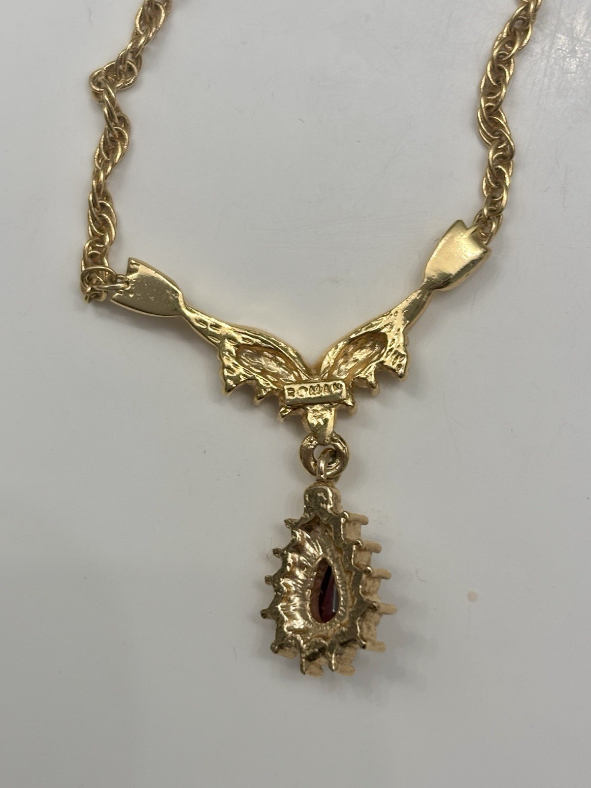 Roman 16 Inch Gold Colored Necklace With Faux Ruby Pendant