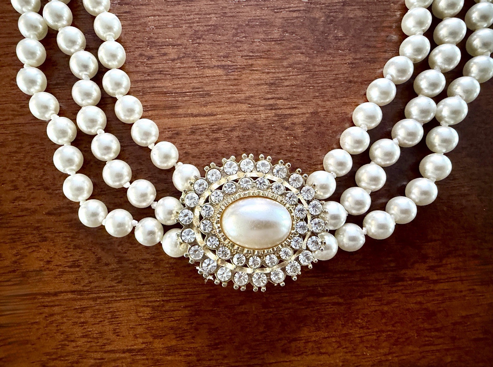 Vintage Triple‑Strand Faux Pearl Necklace w/ Ornate Oval Crystal Clasp – Classic