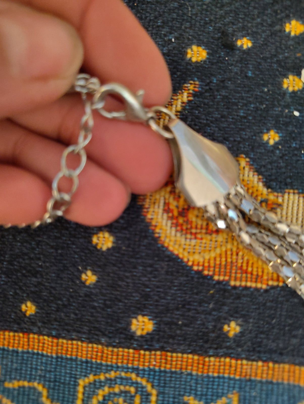 silver-tone chunky braided rope-style statement necklace three knotted details.
