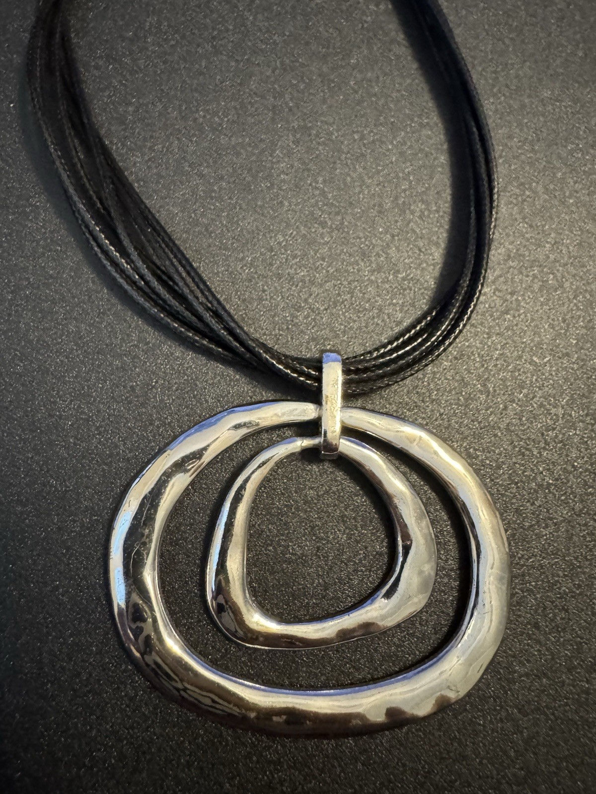 Silver Tone Hammered Metal On Multi Strand Black Cord Necklace M2