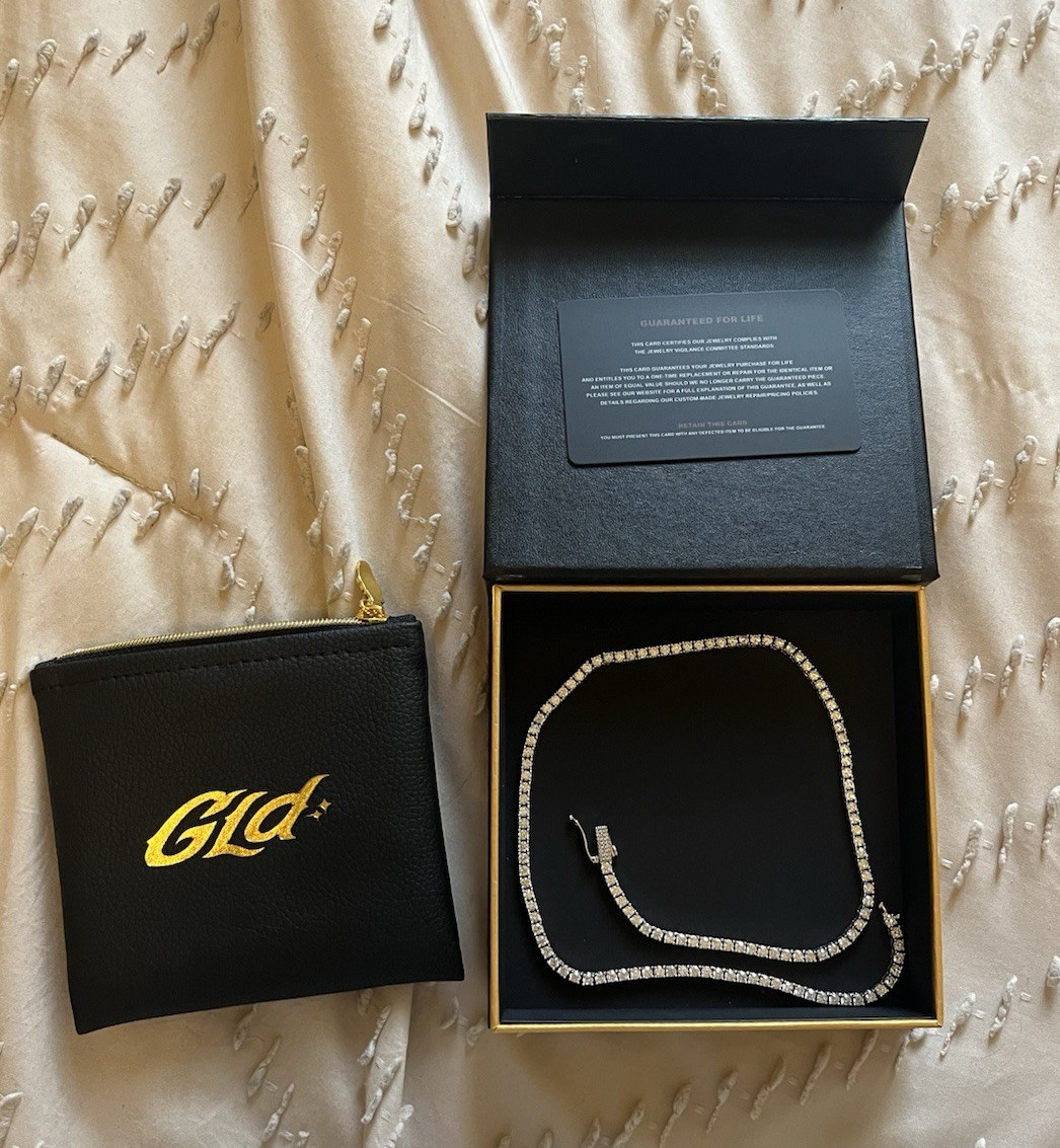 GLD Micro Tennis Chain, 18”, worn twice, excellent condition. Plated white gold