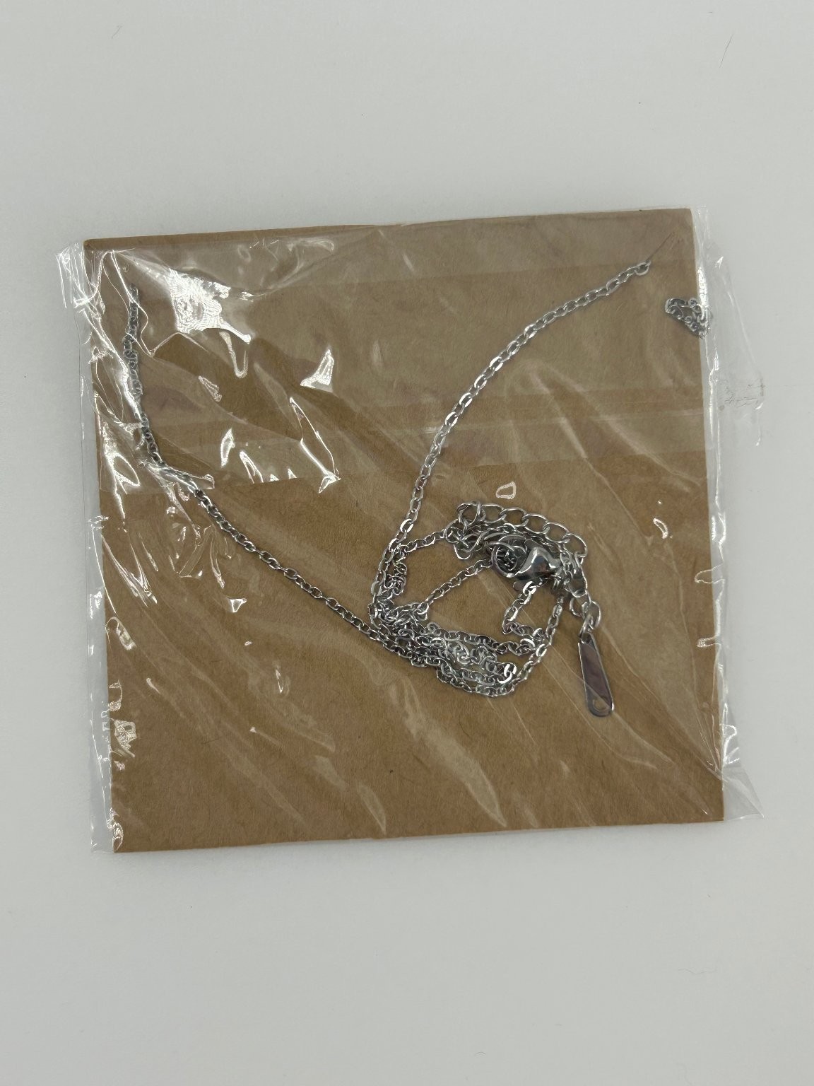 Tie The Knot Silver Tone Necklace with Heart Clasp 16-18 Inch Adjustable
