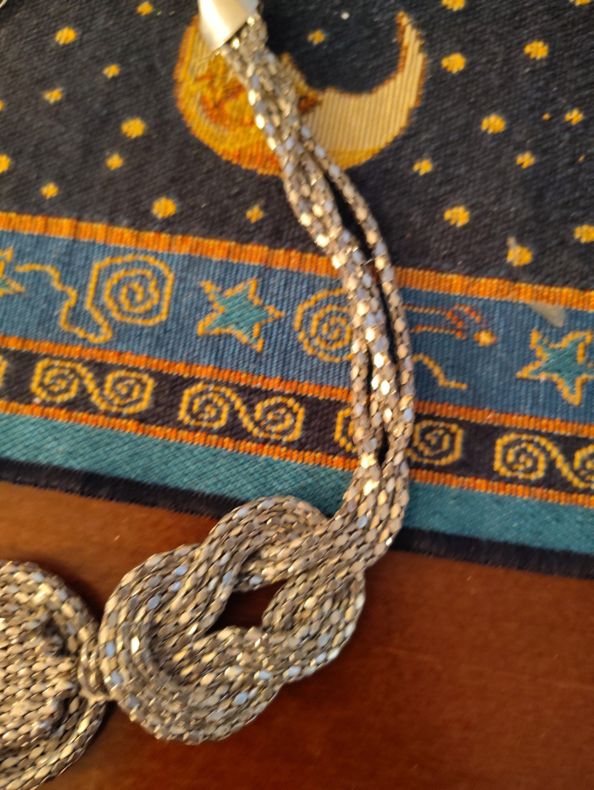 silver-tone chunky braided rope-style statement necklace three knotted details.