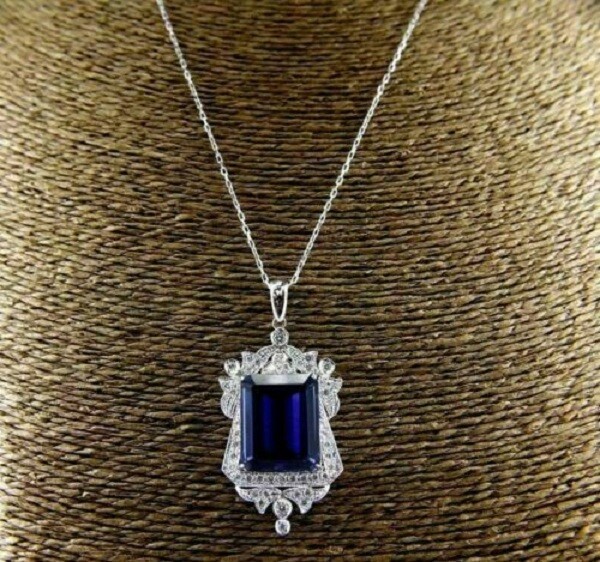 Pretty Emerald Cut Simulated Blue Sapphire Halo Pendant In 14k White Gold Plated