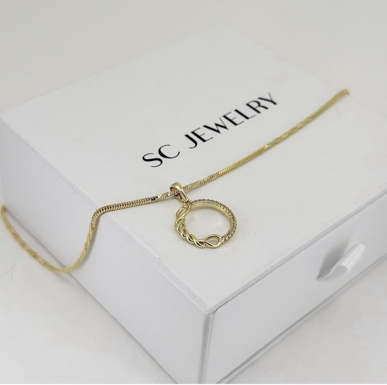 Gold Plated Twisted Circle Pendant Necklace – Pavé Crystal Infinity Round Charm