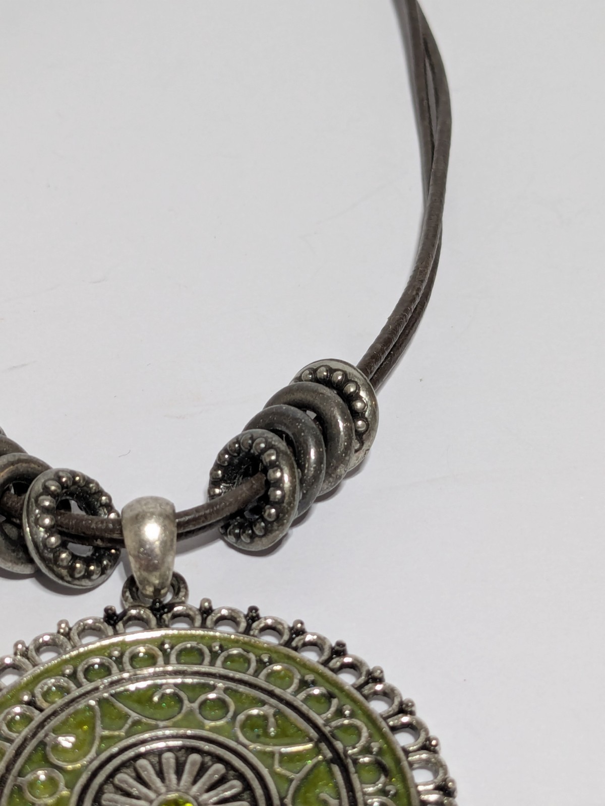 Faux Leather Brown Necklace With Silver Tone & Green Enamel Medallion Pendant
