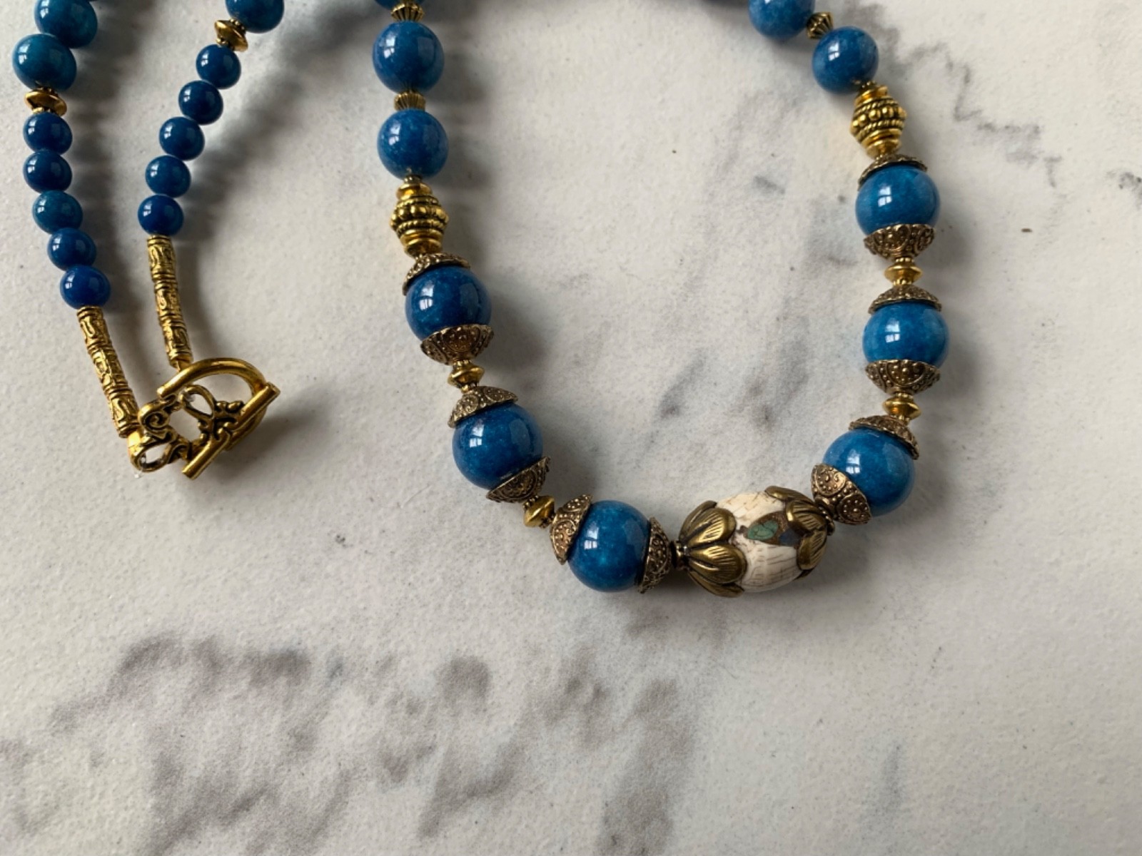 Conch Focal Bead in brass, Blue Howlite beads, Two Conch beads, 20″ Necklace 48