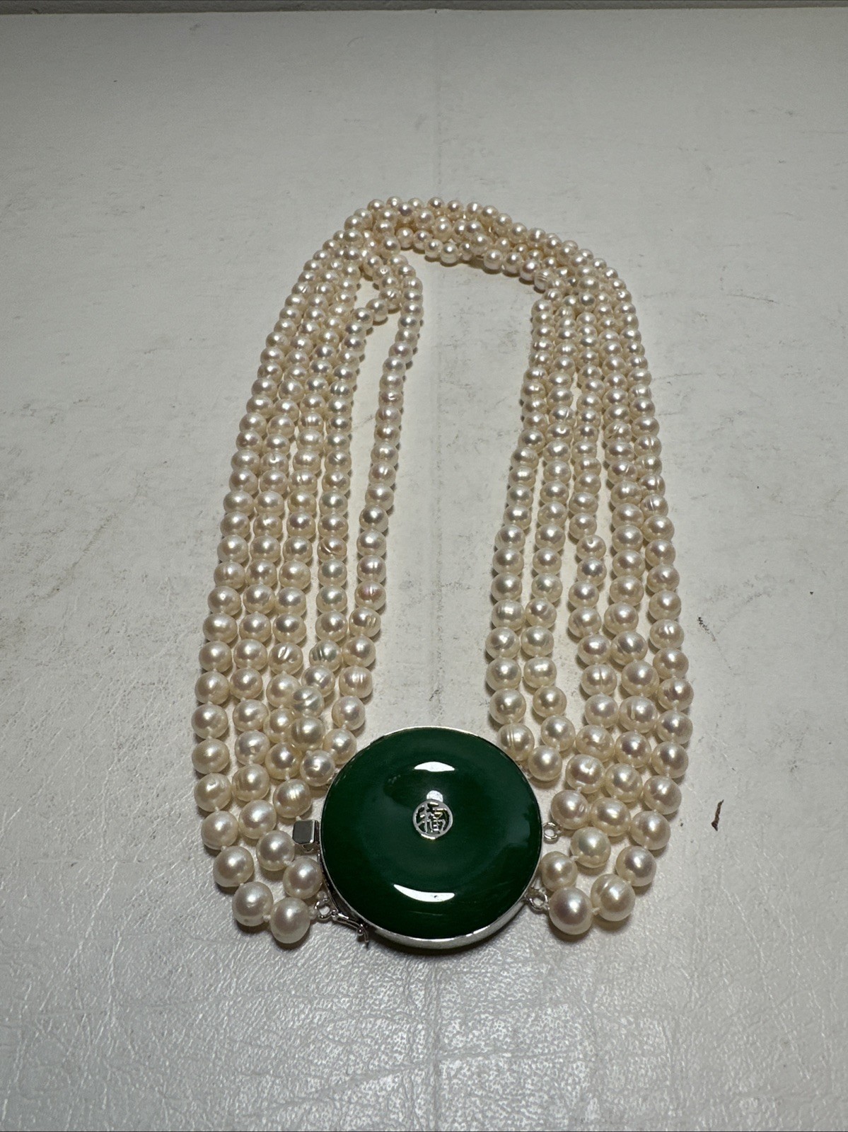 Chinese Natural Pearl Necklace, 925 Silver and a Green Stone In The Middle