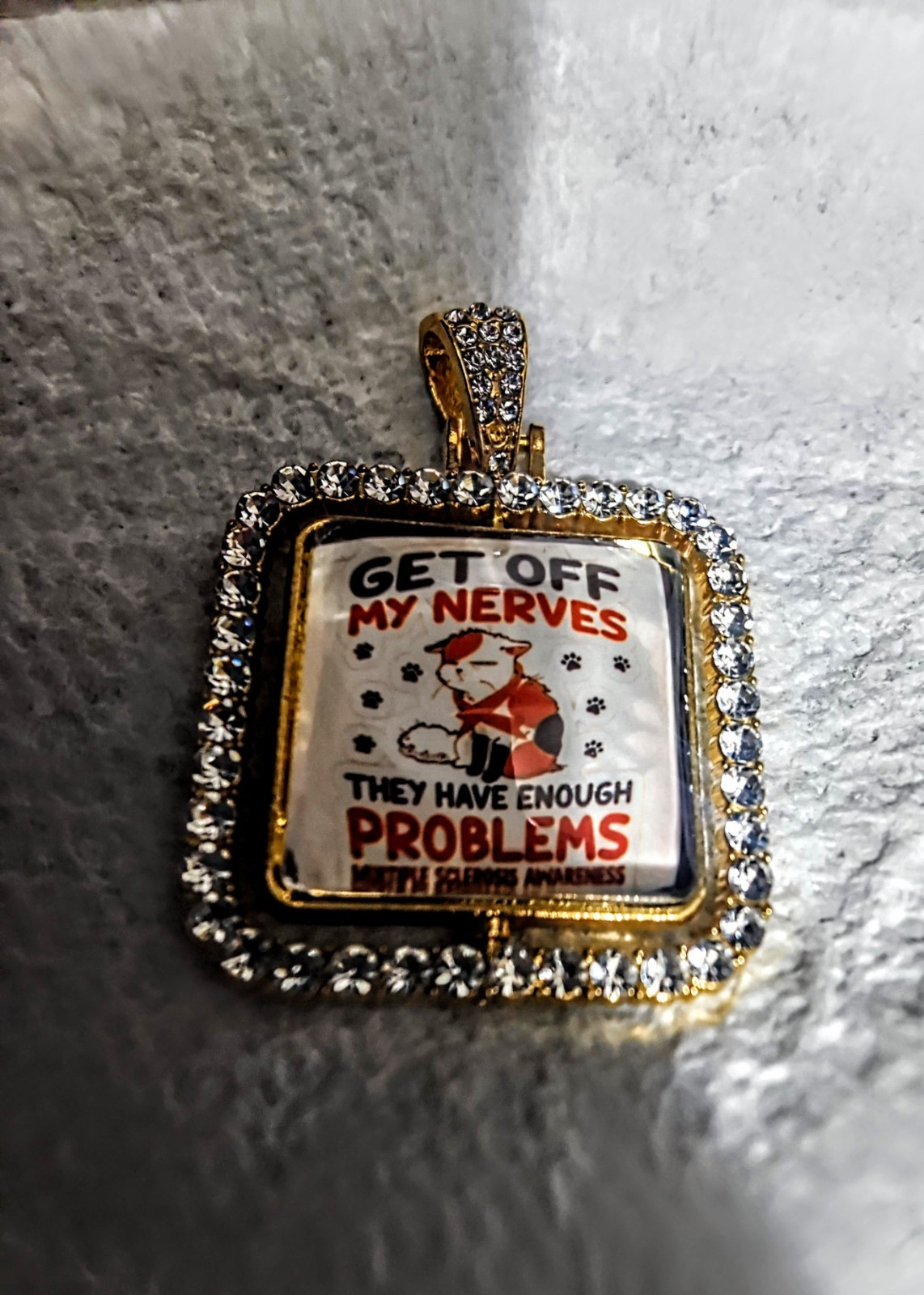 Gold Tone Square Pavé Rhinestone Crystal Pendant Charm, M.S. Awareness “GET OFF”