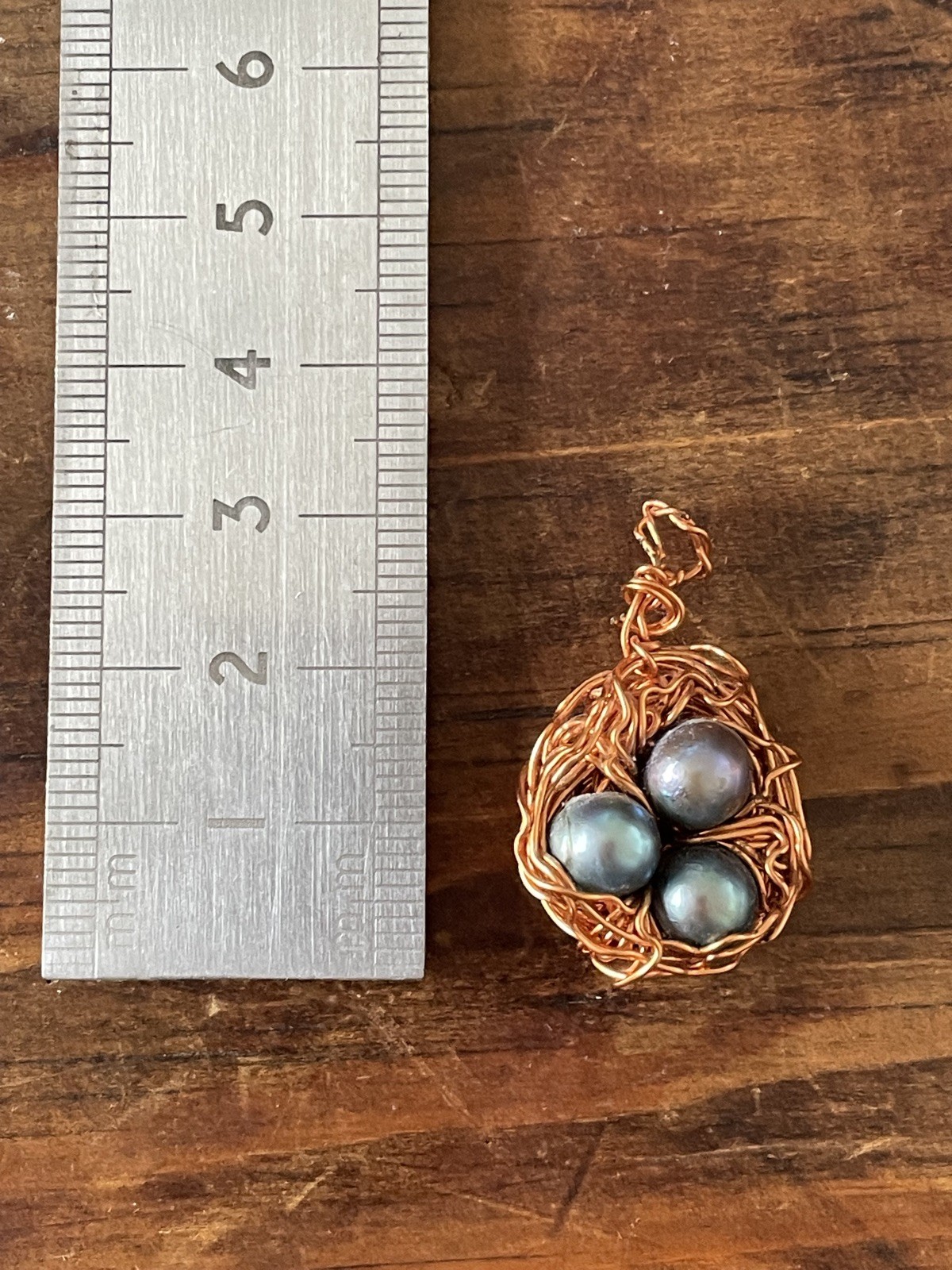 Hand crafted Copper Wire Bird’s Nest Pendant with Blue Pearls