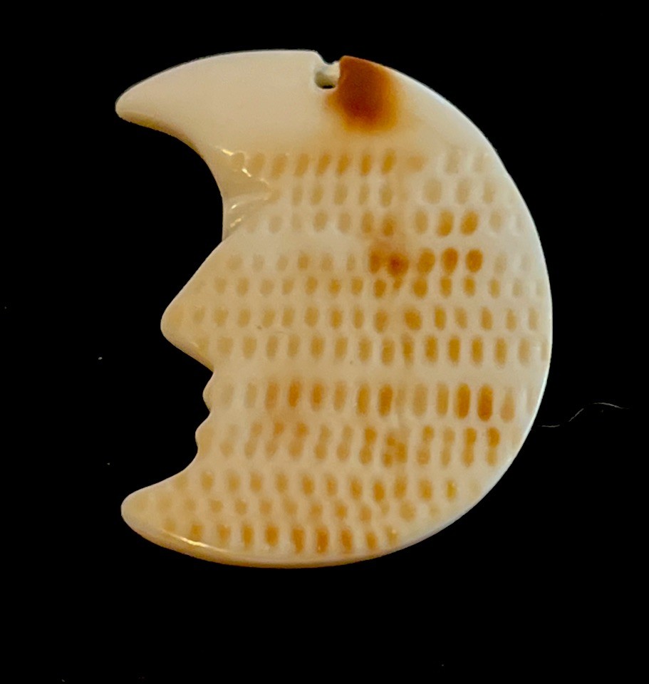 Carved Conch Shell Man In Crescent Moon Pendant