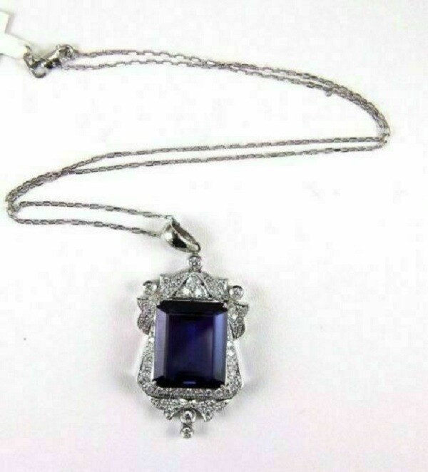 Pretty Emerald Cut Simulated Blue Sapphire Halo Pendant In 14k White Gold Plated