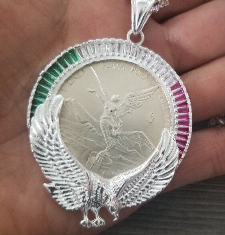 bizel con aguila y zirconia verde blanca y roja y moneda 1 OZ plata 925