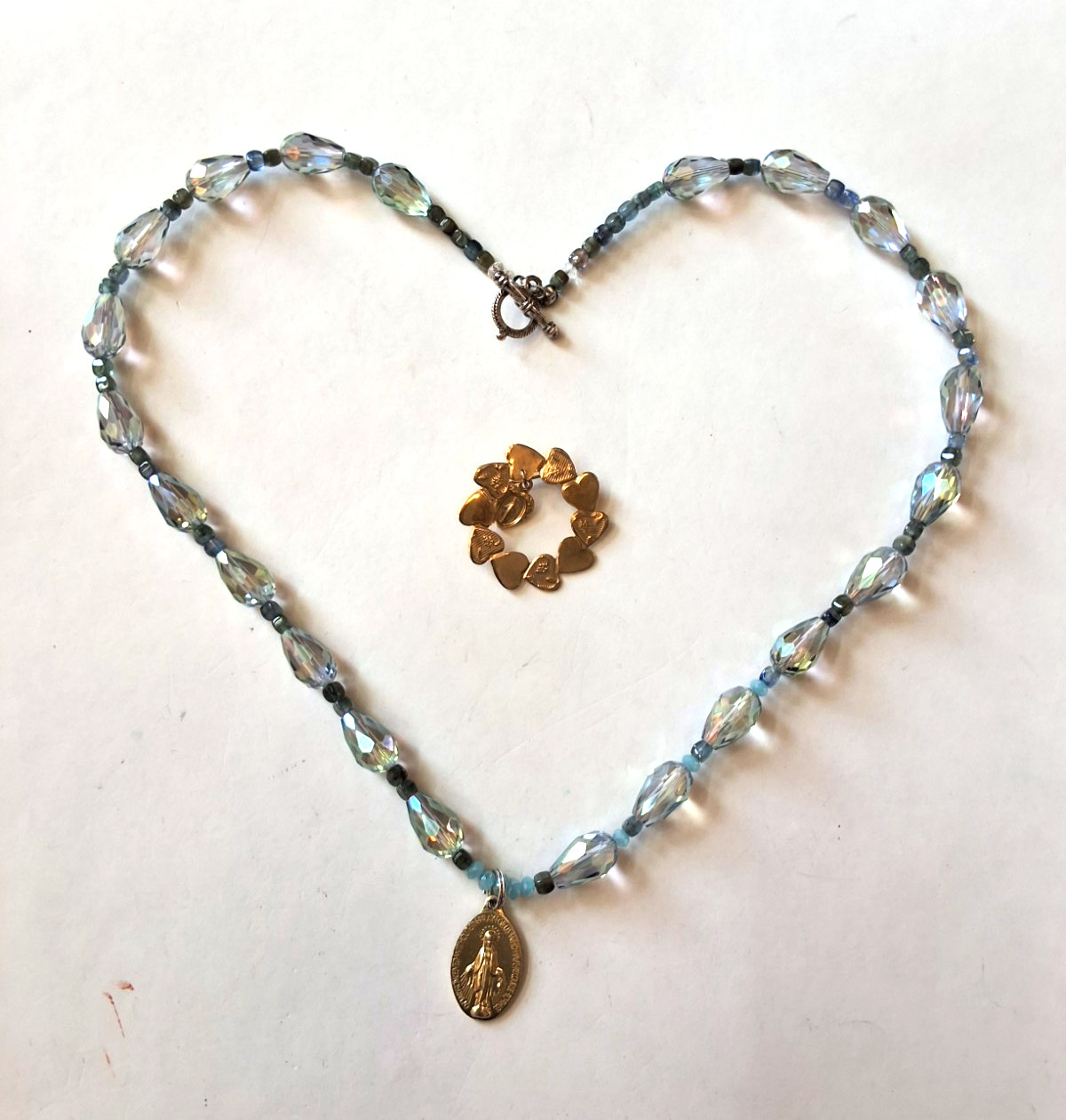 Iridescent Beaded Necklace With Gold Tone Miraculous Medal And Brooch
