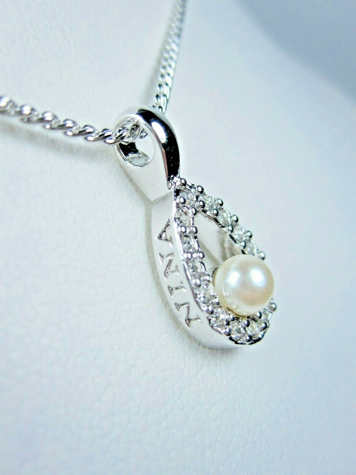 Nina Ricci Rhodium Plated Pendant with Swarovski Crystals & Pearls – 16-18″ 1761
