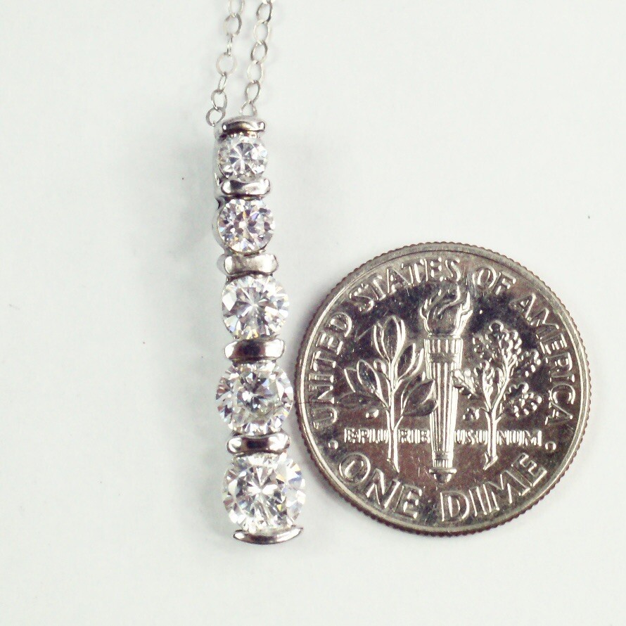 Sterling silver white/colorless CZ graduated five stone pendant necklace
