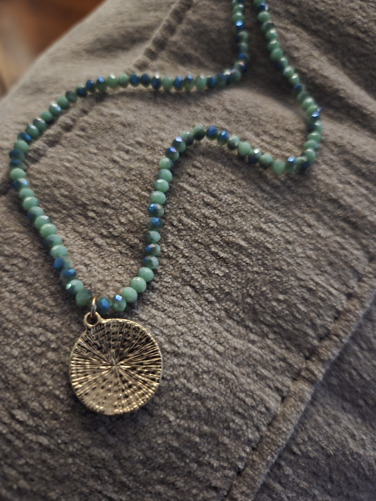 Beaded Necklace In Turquoise Color With Crystal Charm Set In Gold