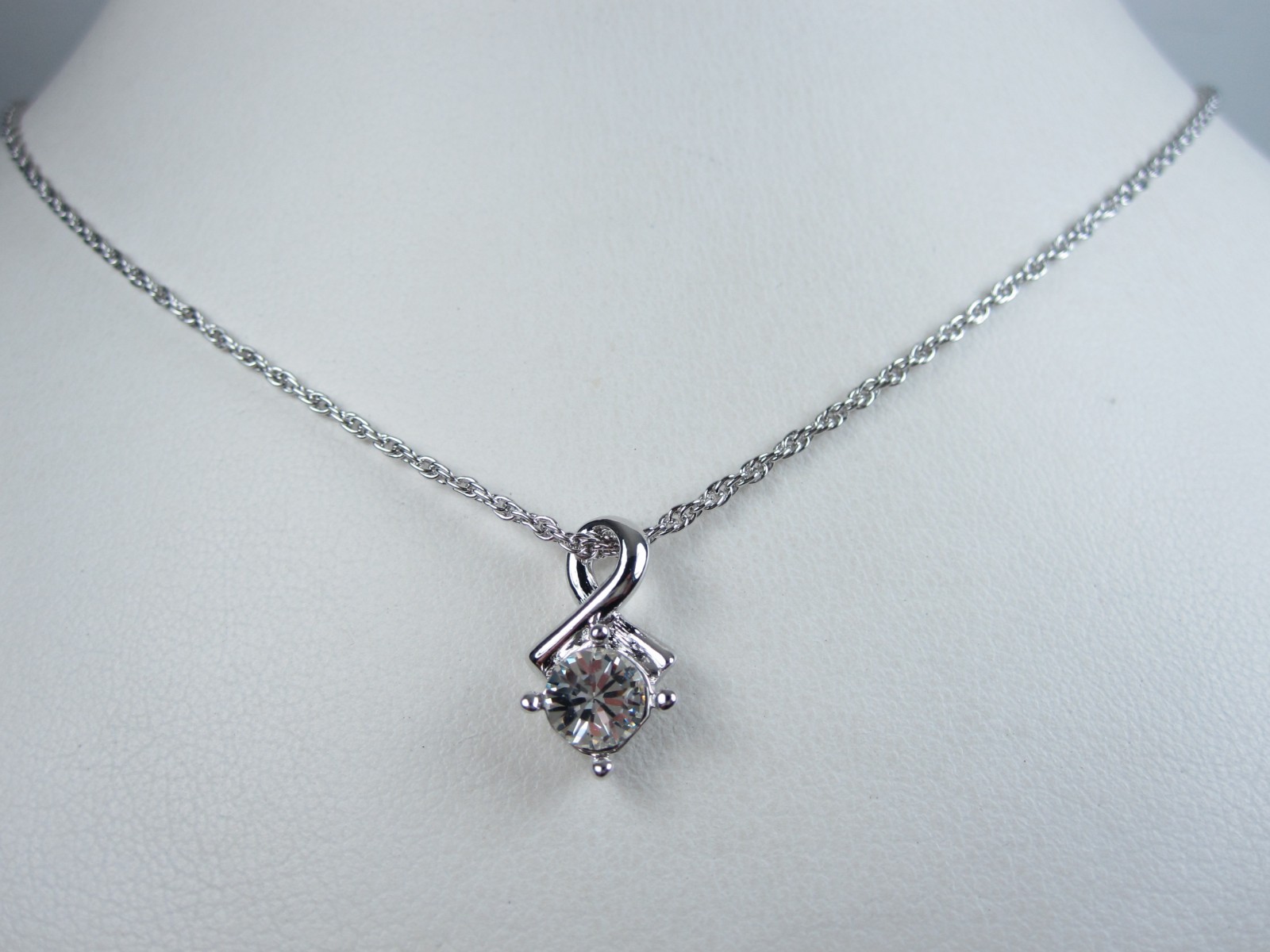 Nina Ricci Rhodium Plated Pendant with Swarovski Crystals – 16-18″ length 9378