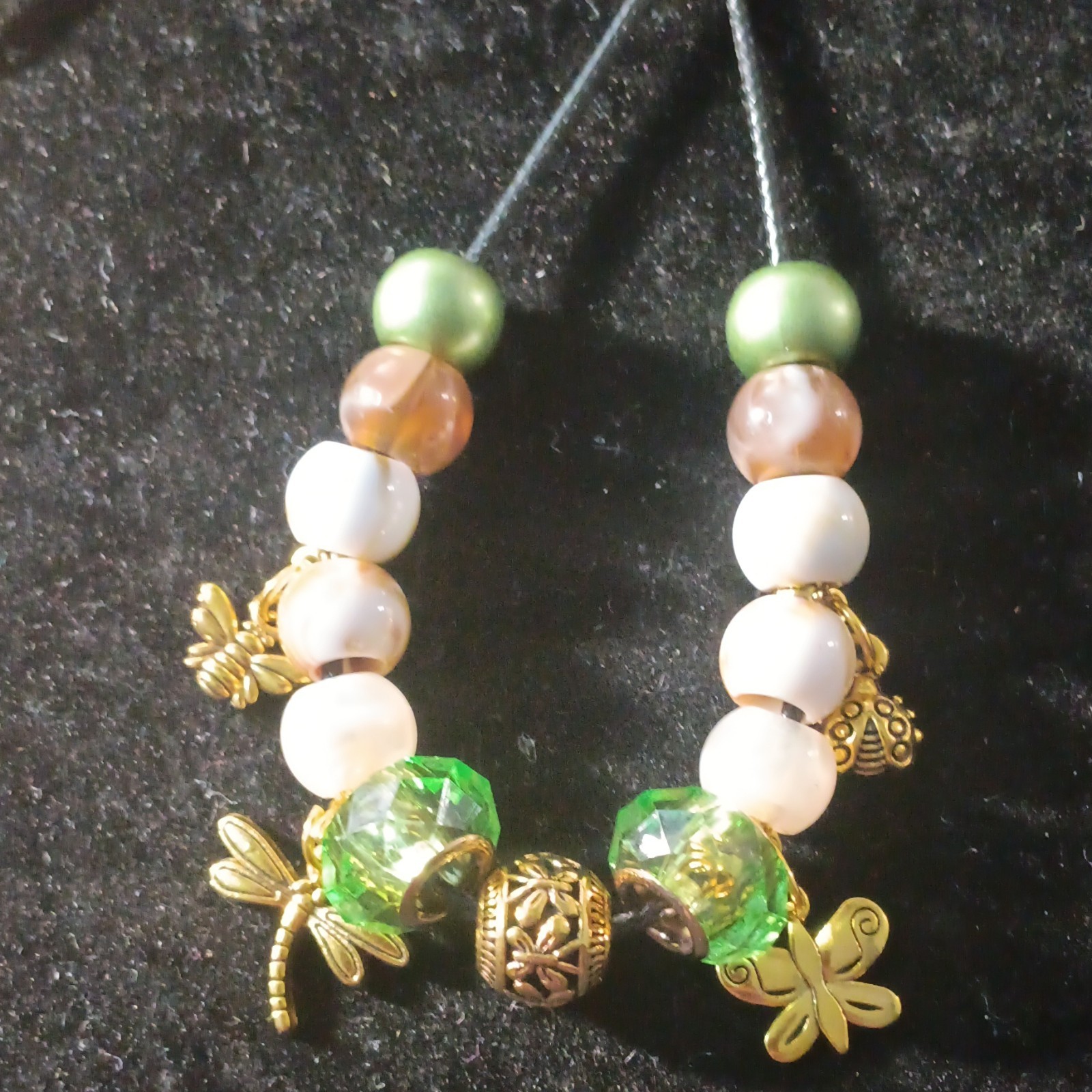 Green, Brown, & White Beaded Cord Necklace With Gold-Tone Insect Charms